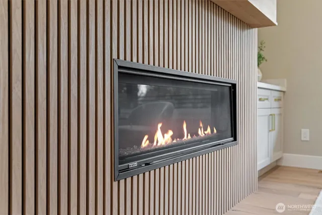 a view of a fireplace with wooden floor