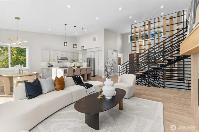 a living room with furniture and a potted plant