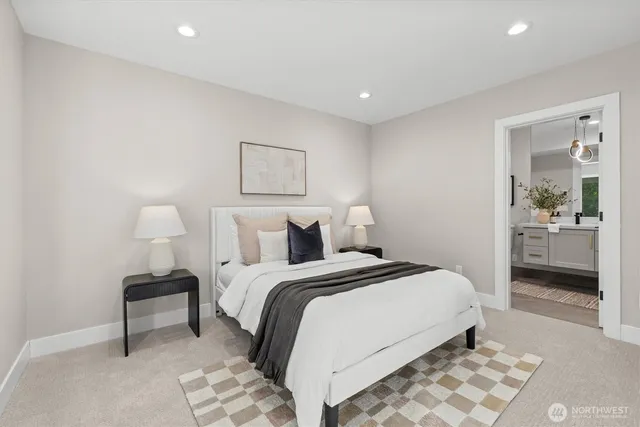 a bedroom with a bed and a lamp