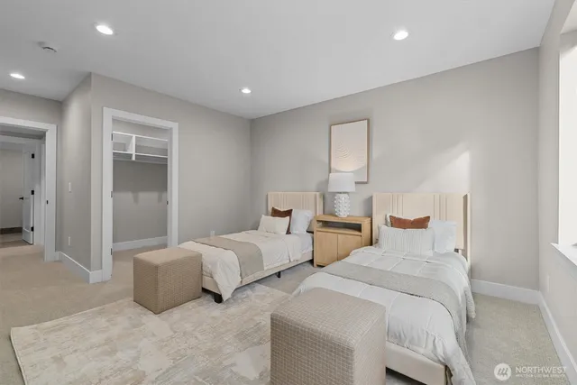 a bedroom with two beds and painted walls