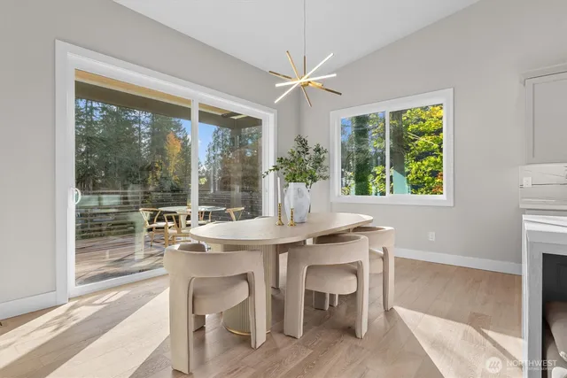 a view of a dining room with furniture window and outside view