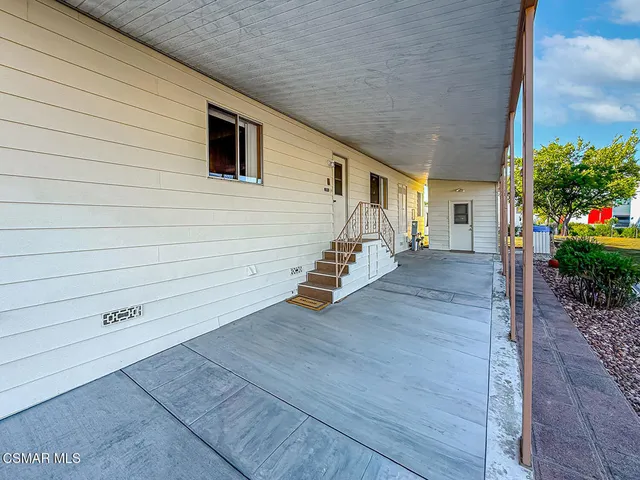 a view of a patio with wooden floor and entryway