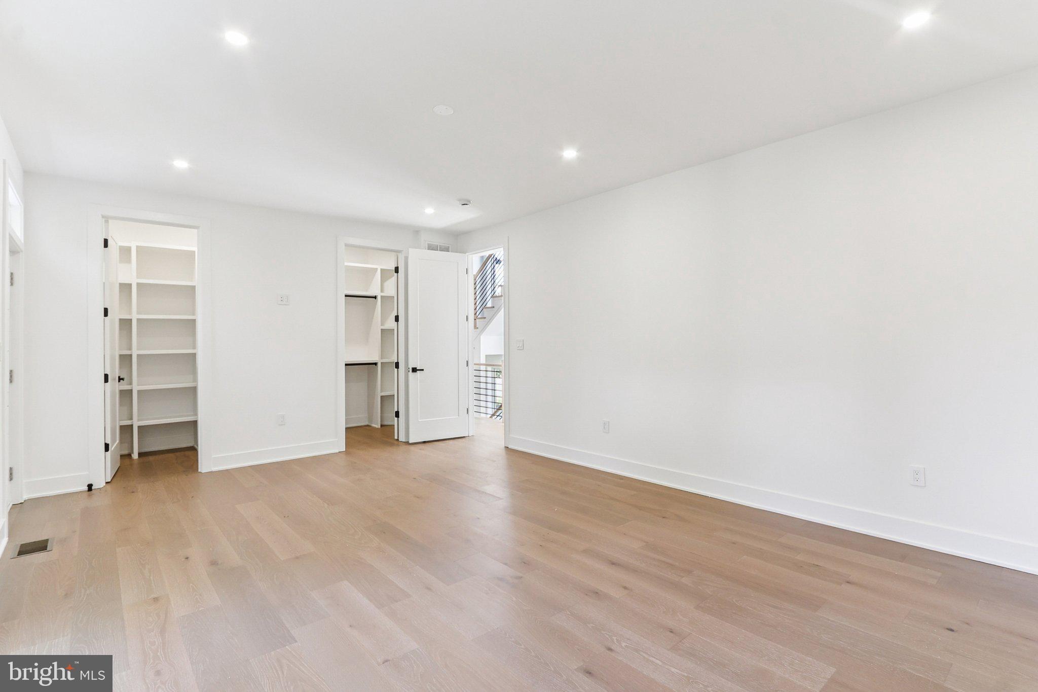 5419 Kempsville Street Springfield, VA 22151 - Photo 22 of 45 a view of an empty room with wooden floor and closet