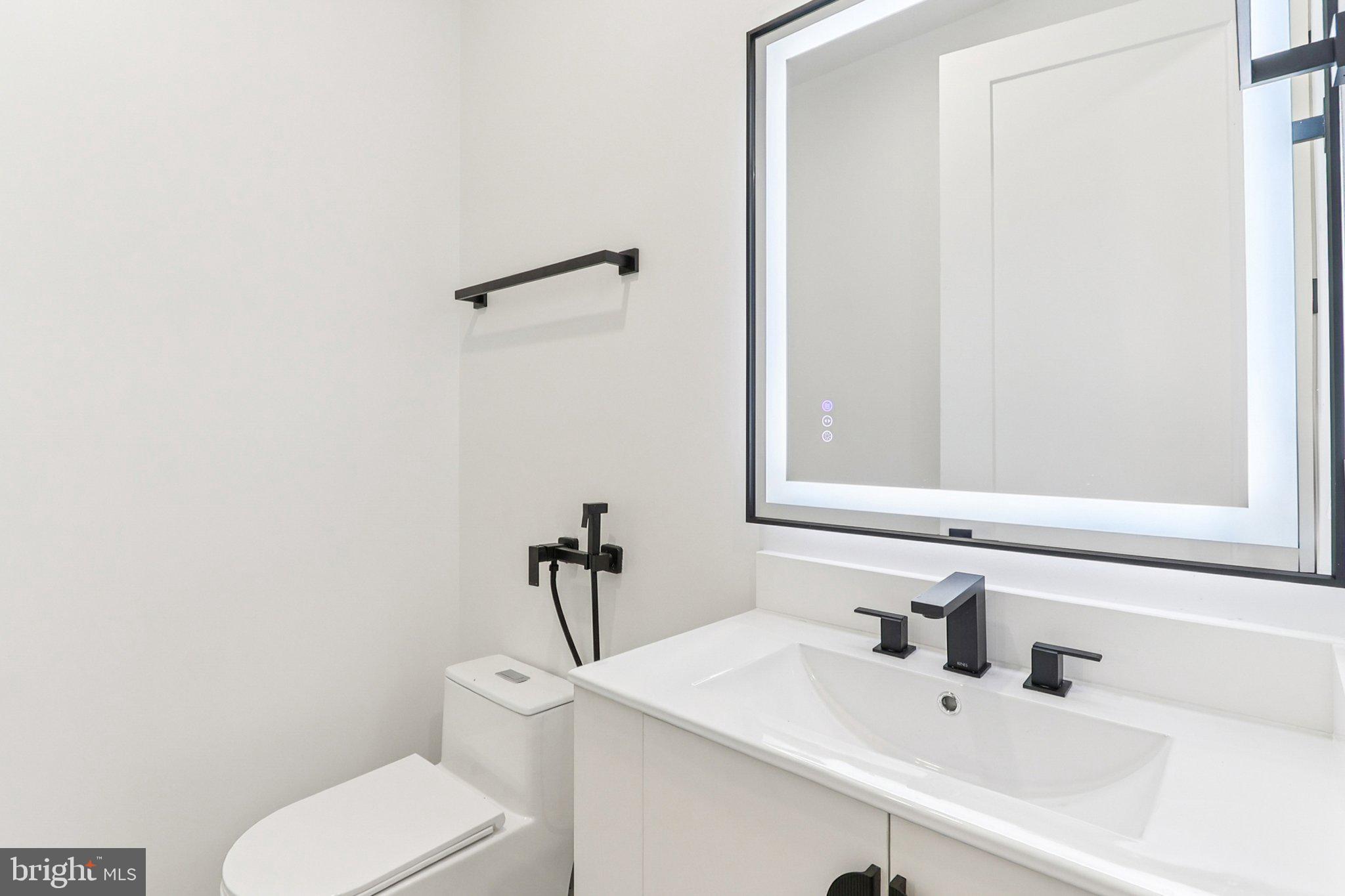 5419 Kempsville Street Springfield, VA 22151 - Photo 25 of 45 a bathroom with a sink and a toilet