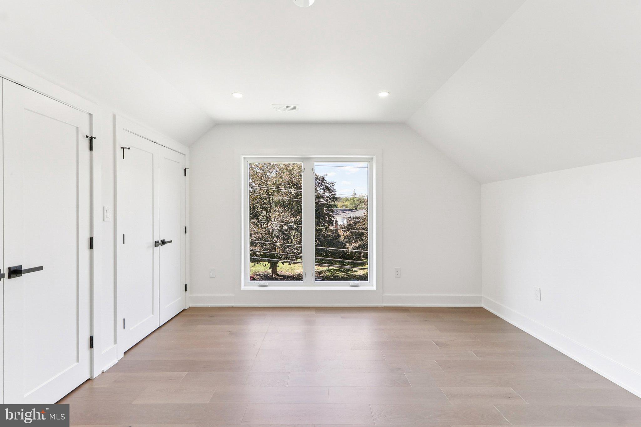 5419 Kempsville Street Springfield, VA 22151 - Photo 41 of 45 wooden floor in an empty room with a window