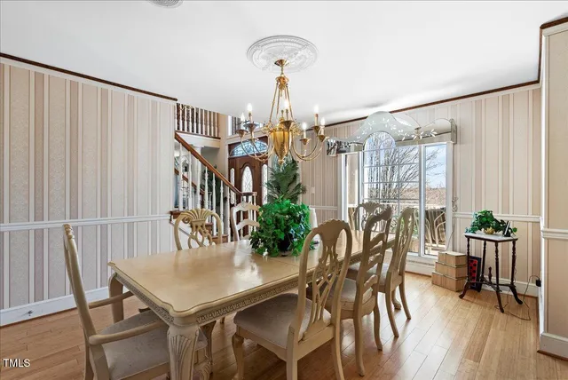 a bedroom with a bed a couch and a painting on the wall