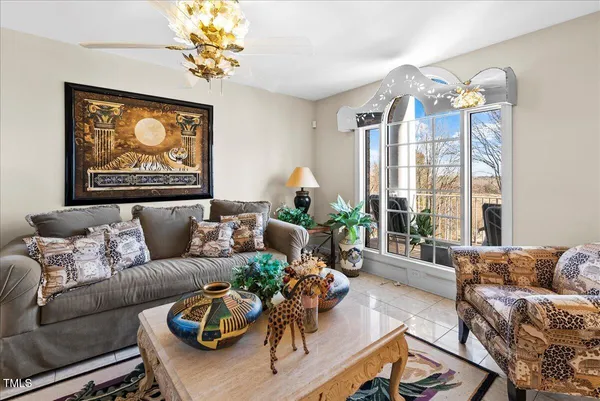 a spacious bathroom with a double vanity sink a mirror a bathtub and next to a window