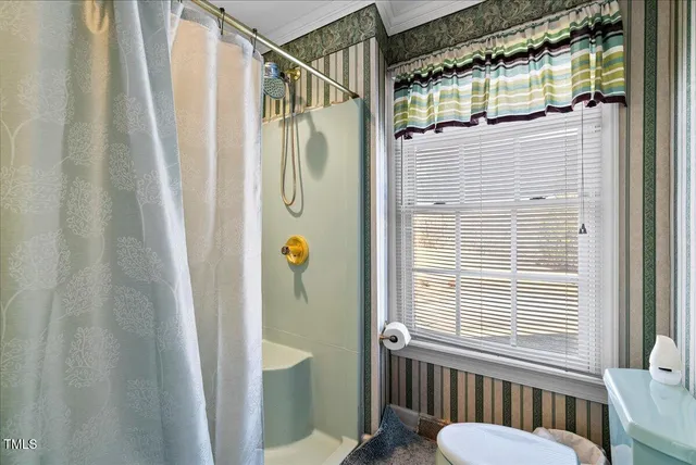 a dining room with furniture and a book shelf
