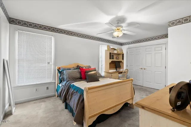 a bedroom with furniture and a chandelier