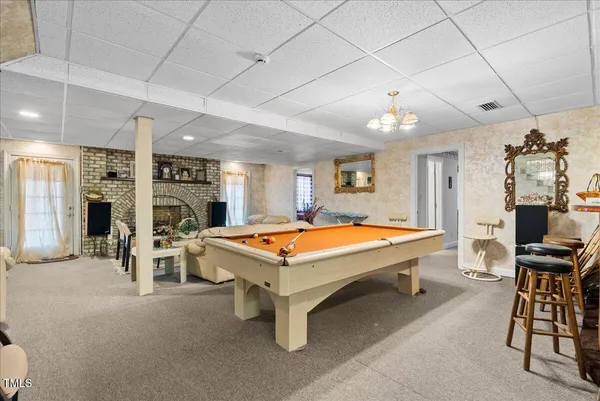 a en suite bathroom with a sink a mirror and shower