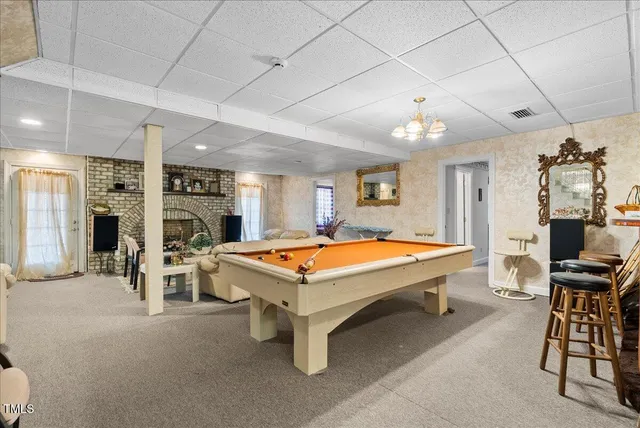a en suite bathroom with a sink a mirror and shower