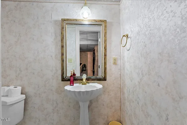 a view of a backyard with table and chairs under an umbrella