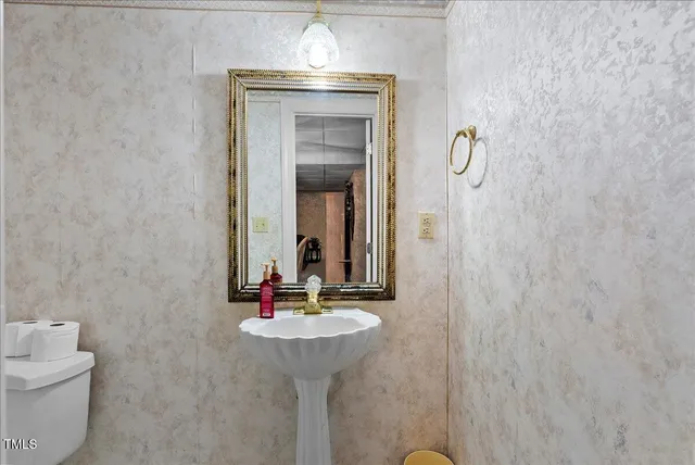 a view of a backyard with table and chairs under an umbrella