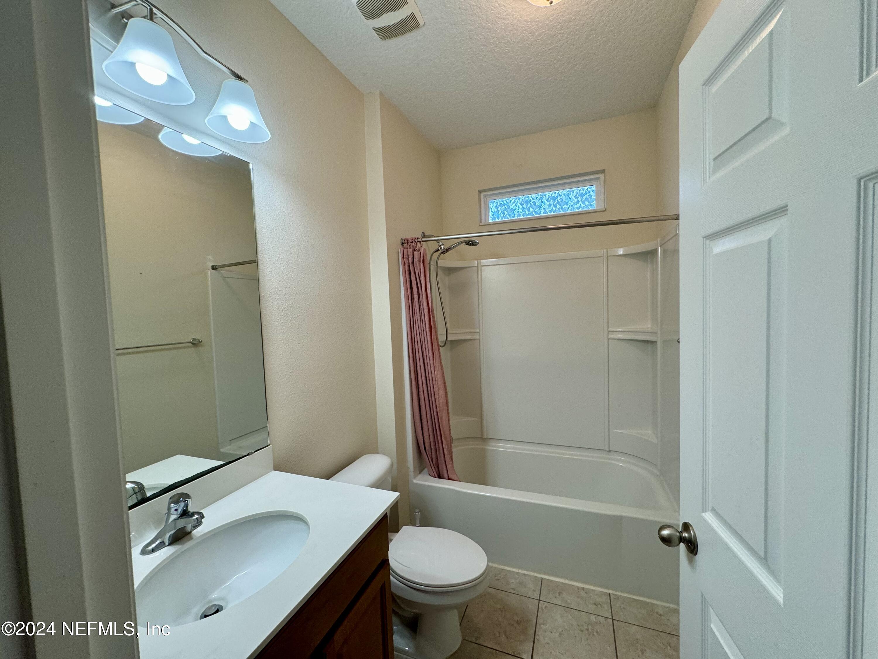 289 Spring Park Avenue Ponte Vedra, FL 32081 - Photo 12 of 19 a bathroom with a sink a toilet and shower