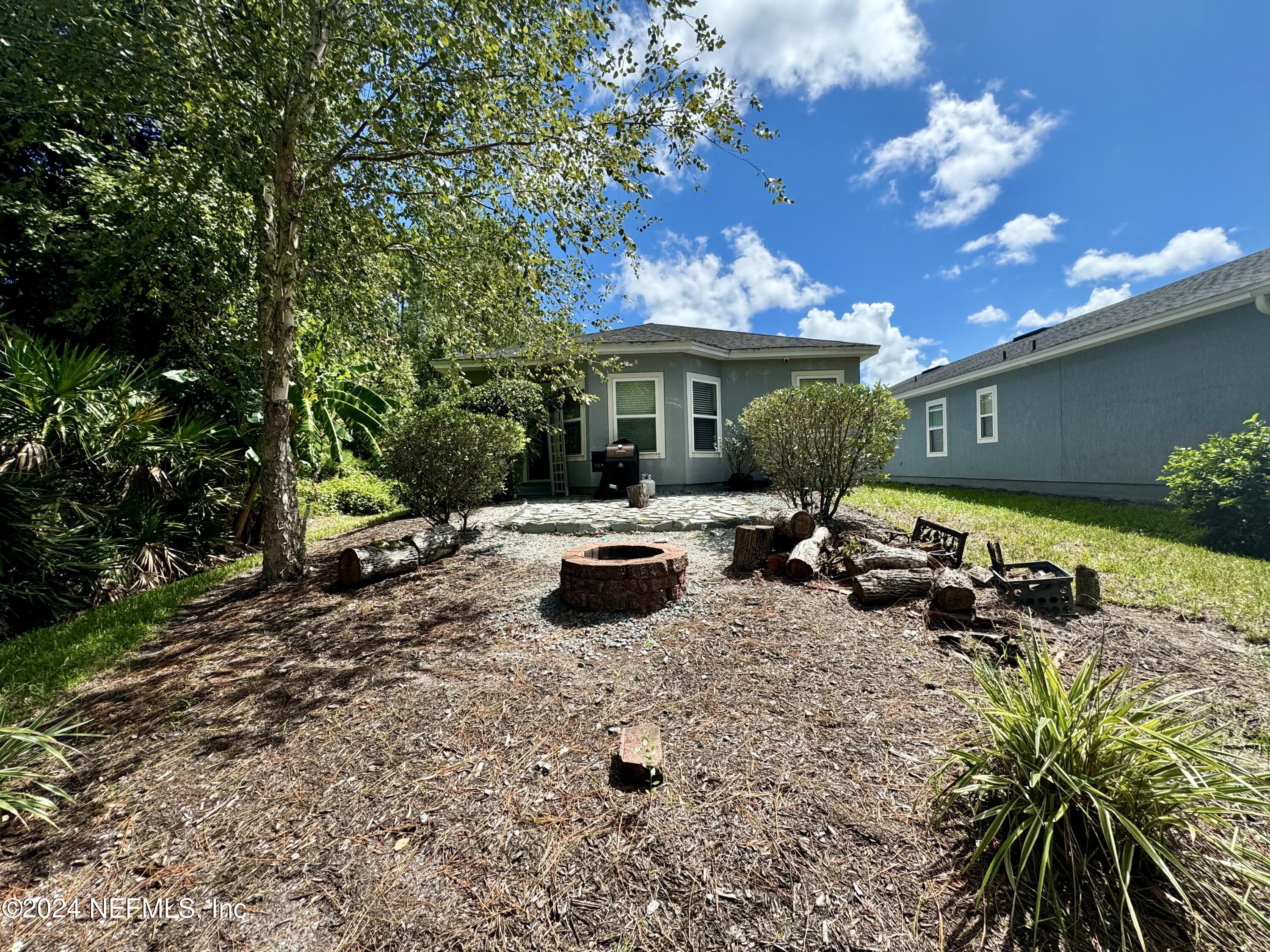 289 Spring Park Avenue Ponte Vedra, FL 32081 - Photo 14 of 19 a front view of a house with yard and sitting area