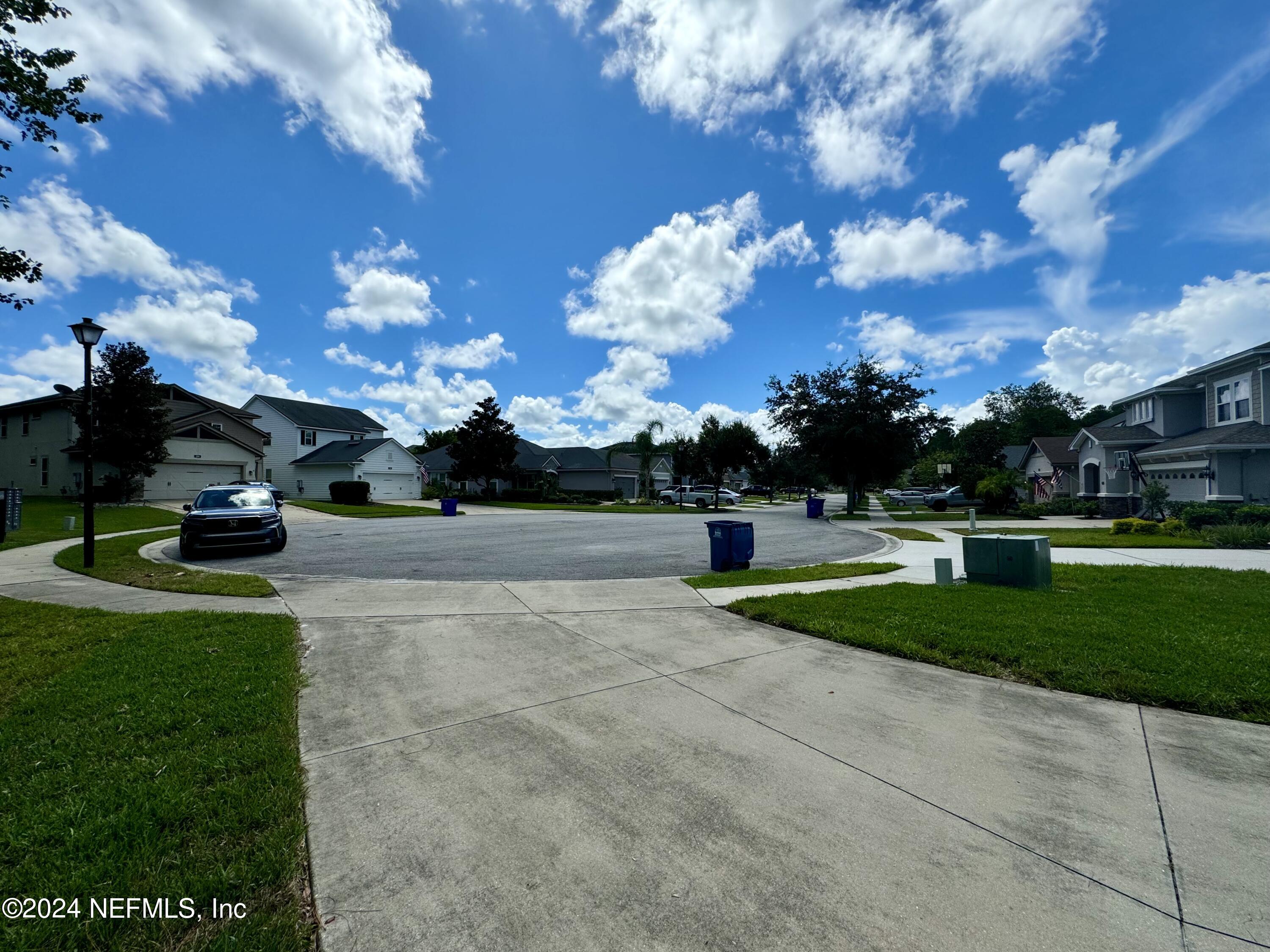 289 Spring Park Avenue Ponte Vedra, FL 32081 - Photo 17 of 19 a view of a garden with houses