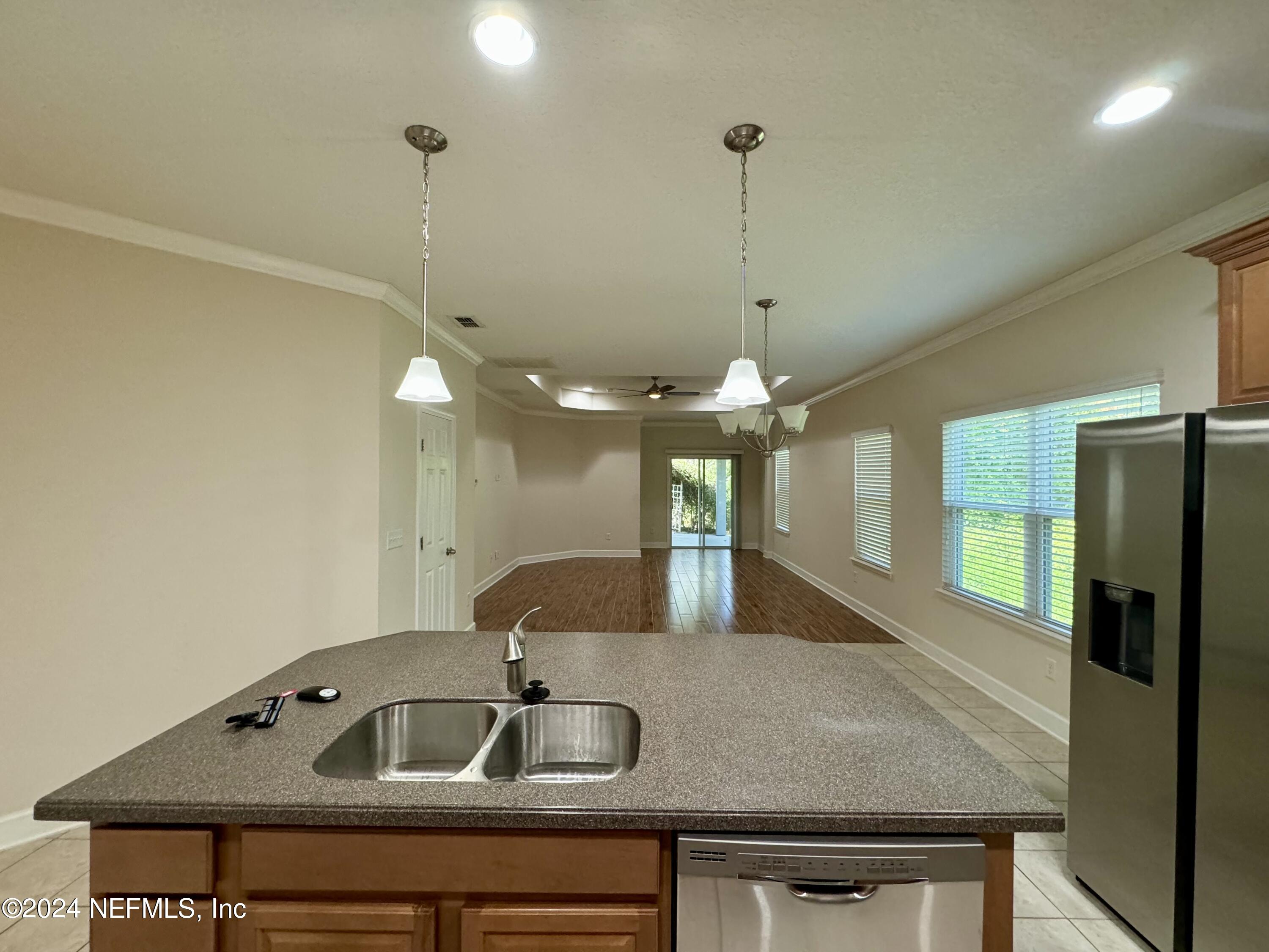 289 Spring Park Avenue Ponte Vedra, FL 32081 - Photo 19 of 19 a kitchen with a sink a counter space and appliances