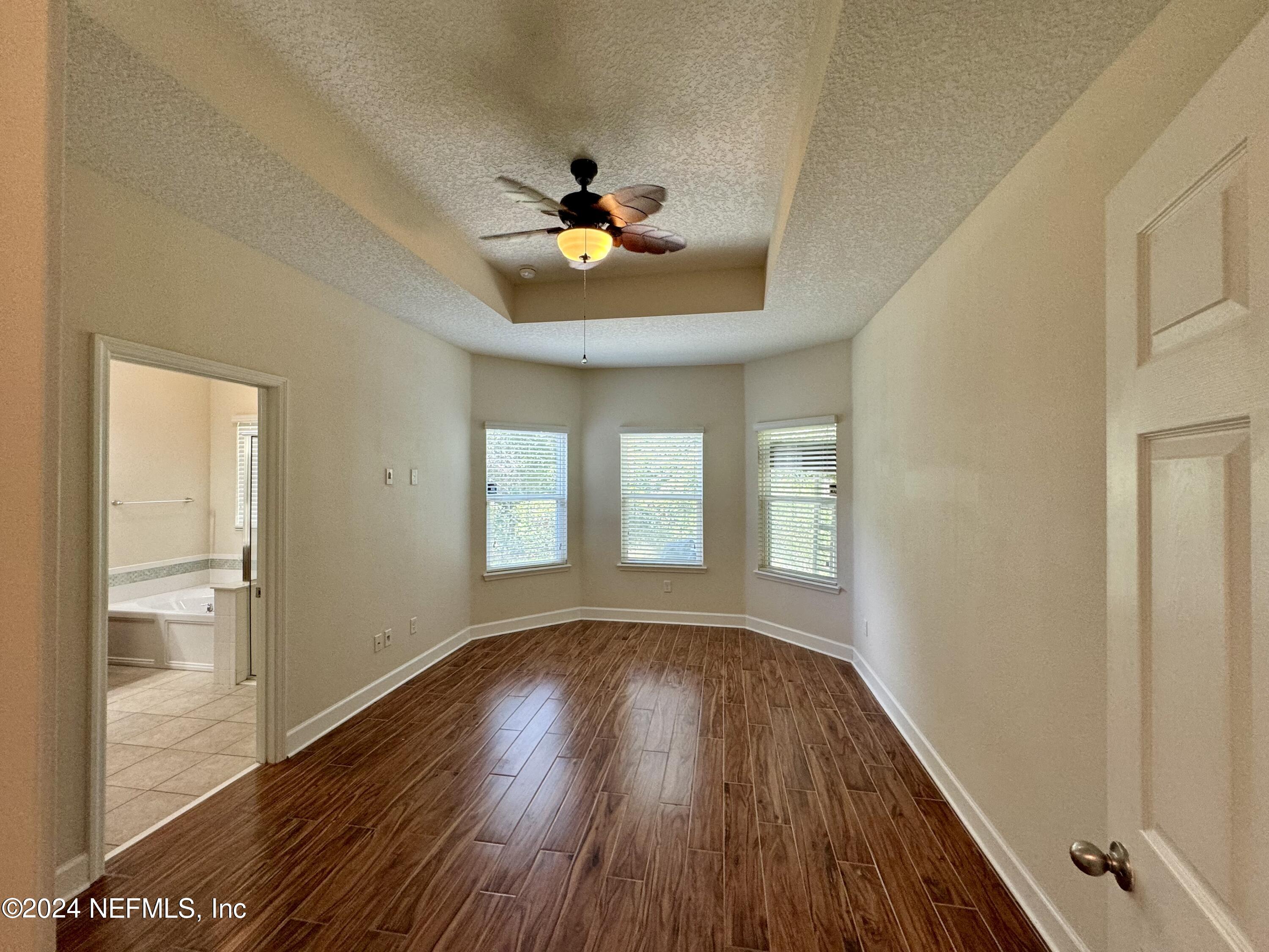 289 Spring Park Avenue Ponte Vedra, FL 32081 - Photo 6 of 19 a view of empty room with wooden floor and fan