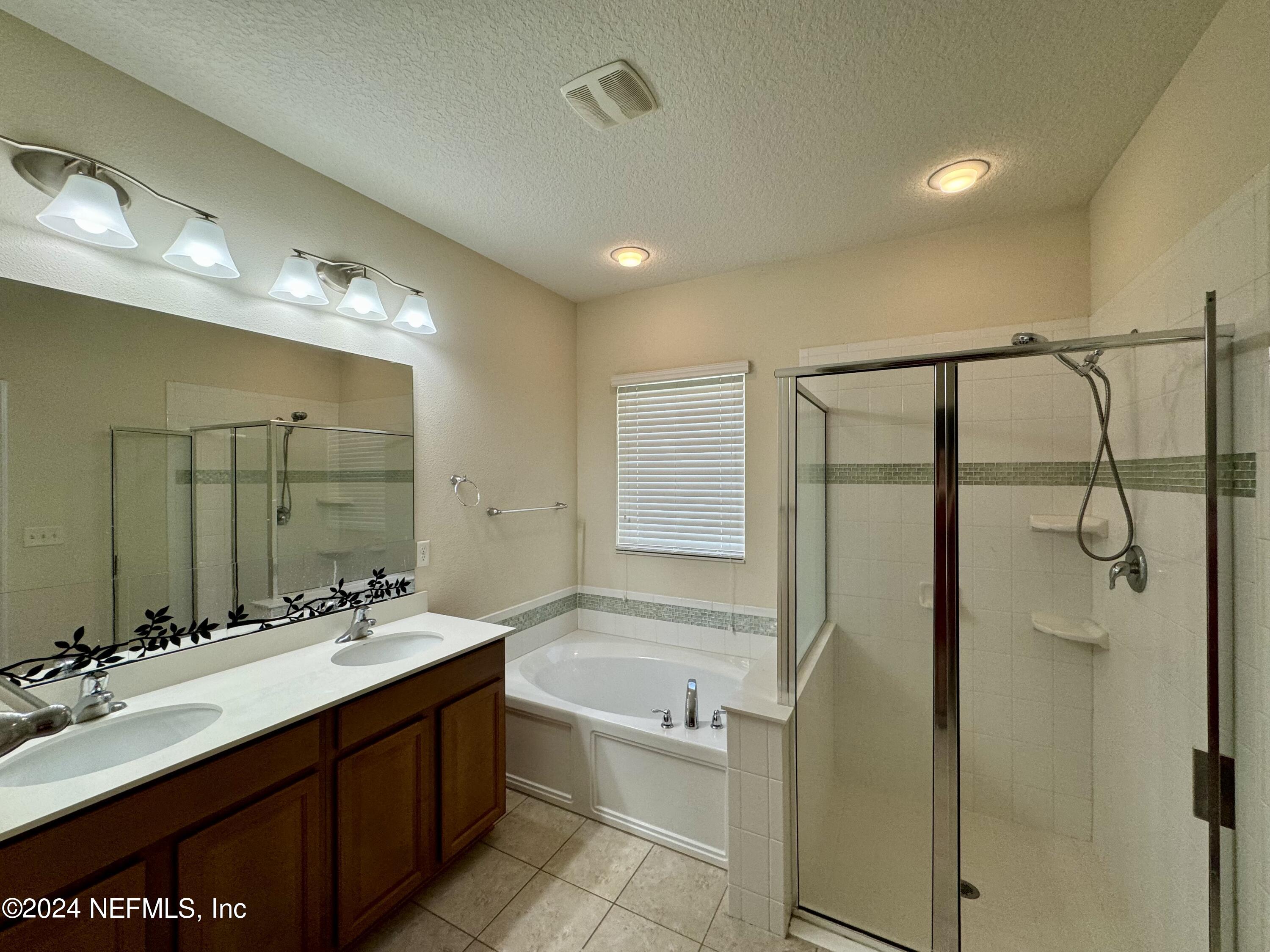 289 Spring Park Avenue Ponte Vedra, FL 32081 - Photo 7 of 19 a bathroom with a tub sink shower and mirror