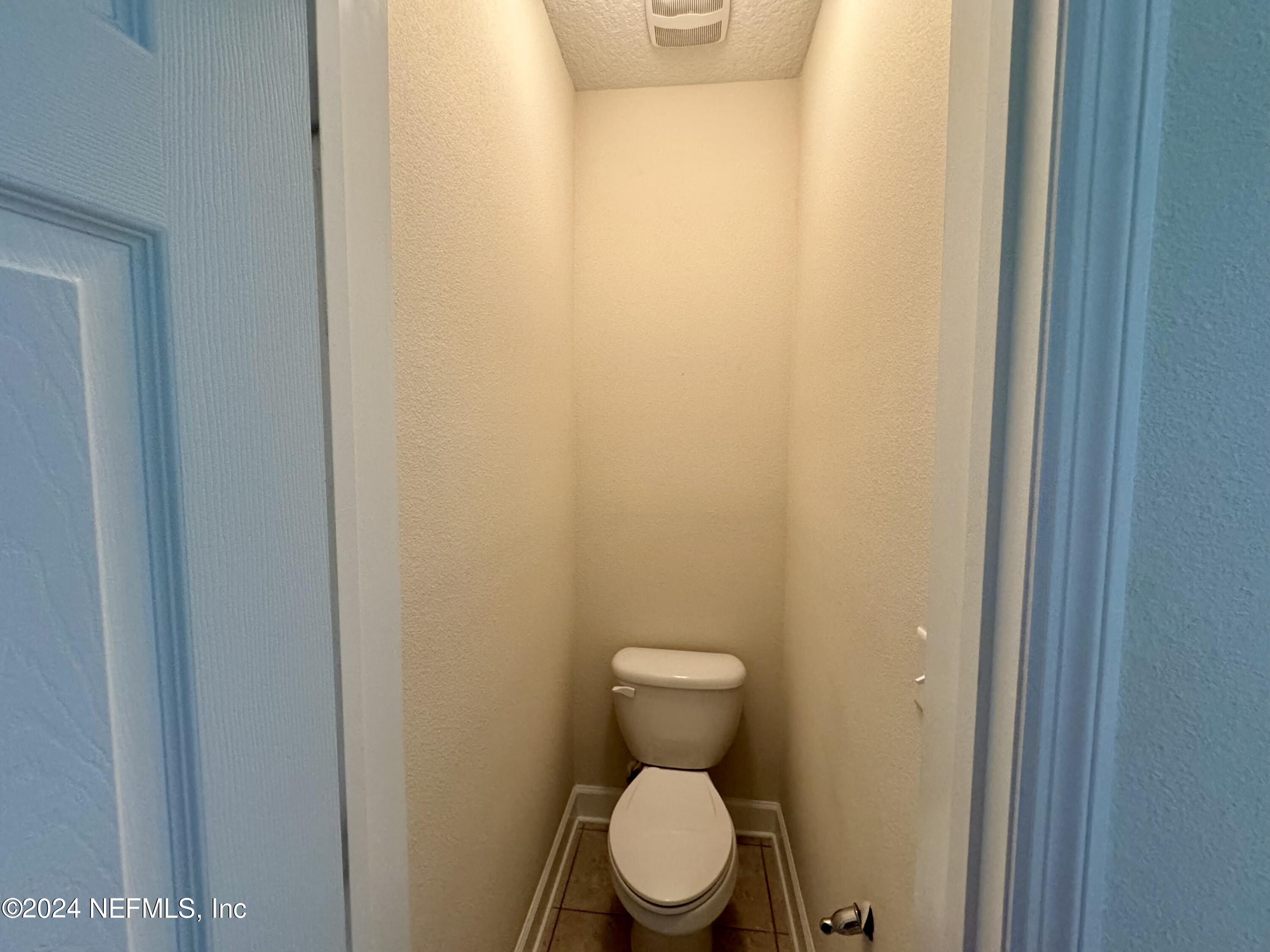 289 Spring Park Avenue Ponte Vedra, FL 32081 - Photo 8 of 19 a white toilet sitting next to a white wall