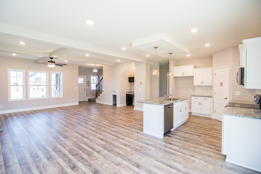 255 Mill Creek Road Clarksville, TN 37042 - Photo 5 of 10 a large kitchen with cabinets and wooden floor
