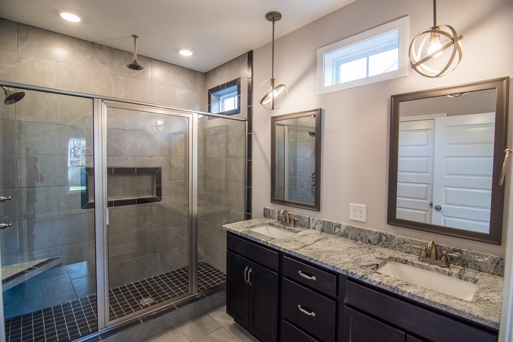 255 Mill Creek Road Clarksville, TN 37042 - Photo 9 of 10 a bathroom with a granite countertop sink mirror and shower