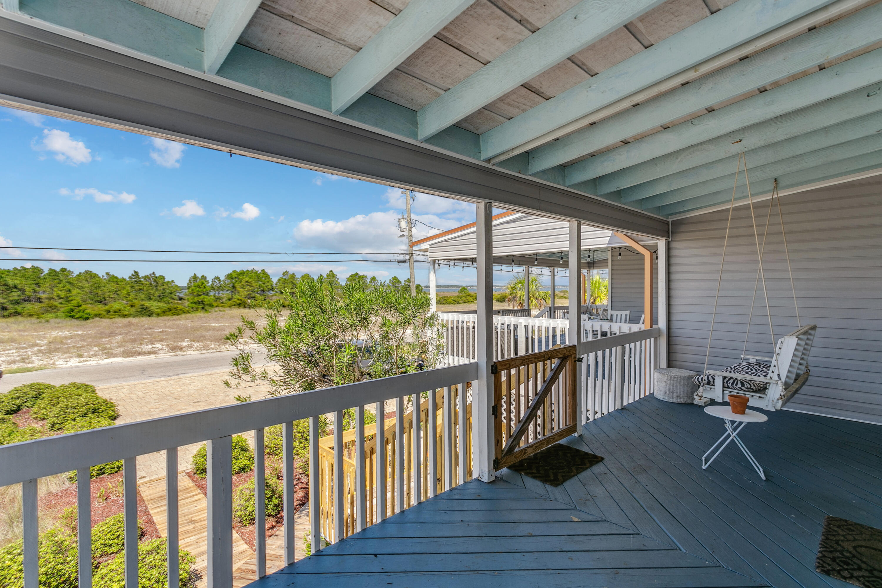 7905 White Sands Boulevard, Unit 2 Navarre, FL 32566 - Photo 11 of 51 a view of a balcony with chairs