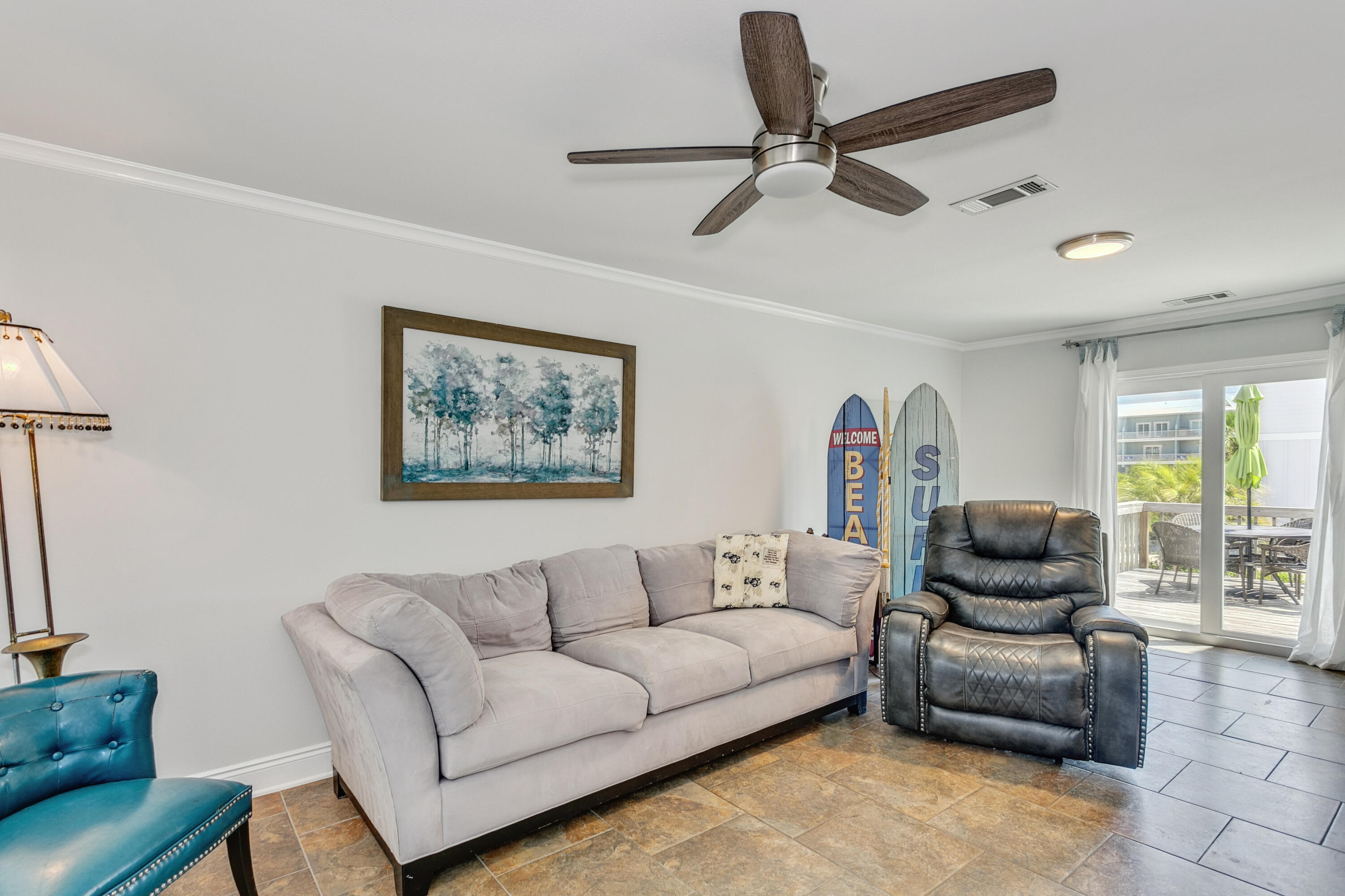 7905 White Sands Boulevard, Unit 2 Navarre, FL 32566 - Photo 13 of 51 a living room with furniture and a rug
