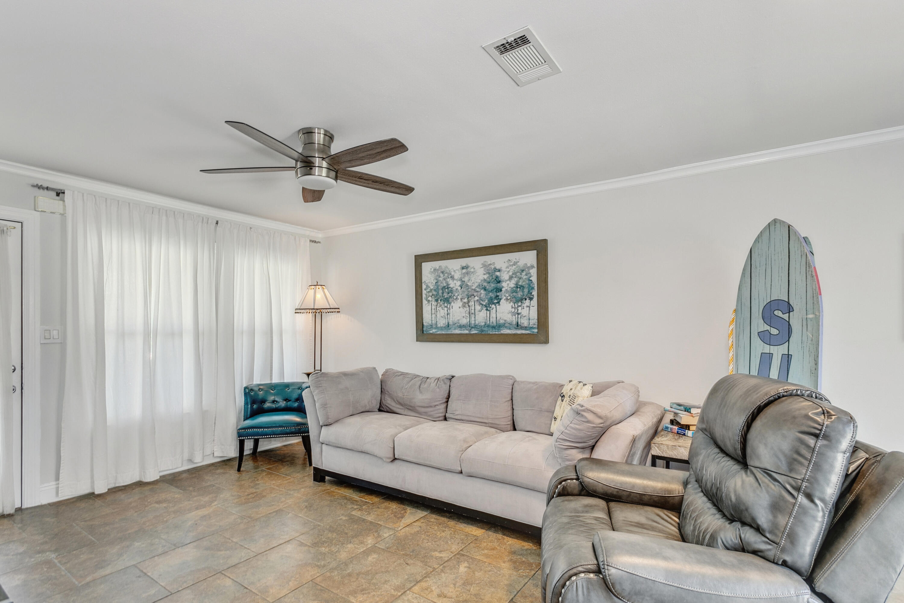 7905 White Sands Boulevard, Unit 2 Navarre, FL 32566 - Photo 15 of 51 a living room with furniture and a ceiling fan