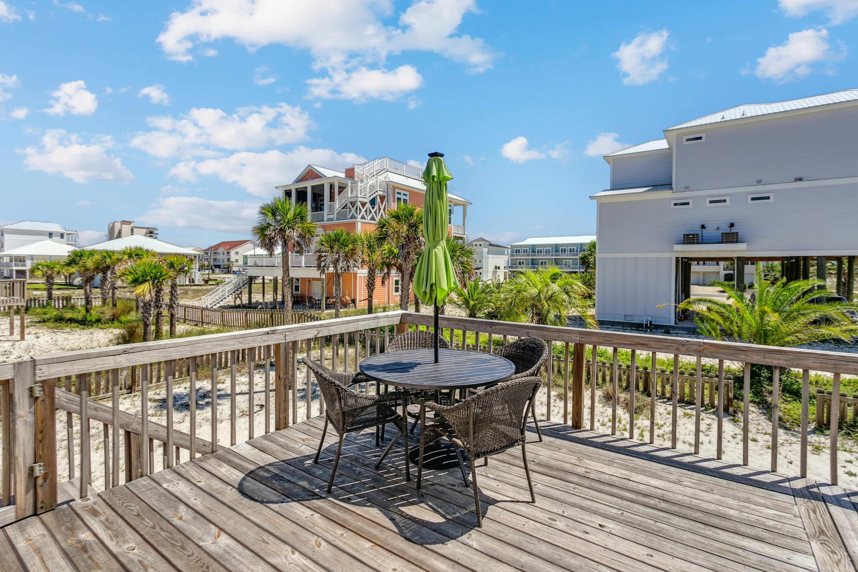 7905 White Sands Boulevard, Unit 2 Navarre, FL 32566 - Photo 28 of 51 a view of a balcony with furniture