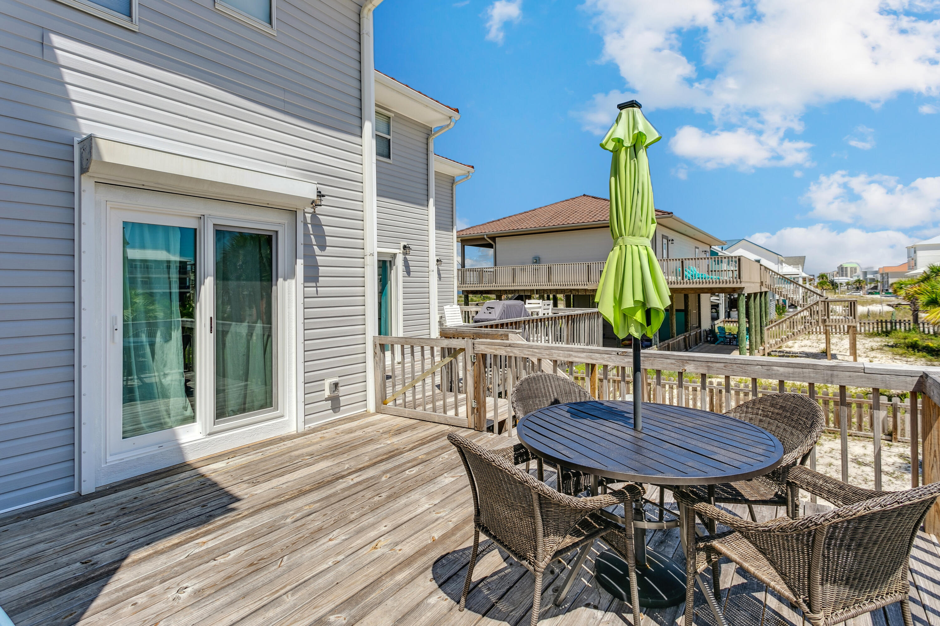7905 White Sands Boulevard, Unit 2 Navarre, FL 32566 - Photo 29 of 51 a view of a table and chairs in patio of the house