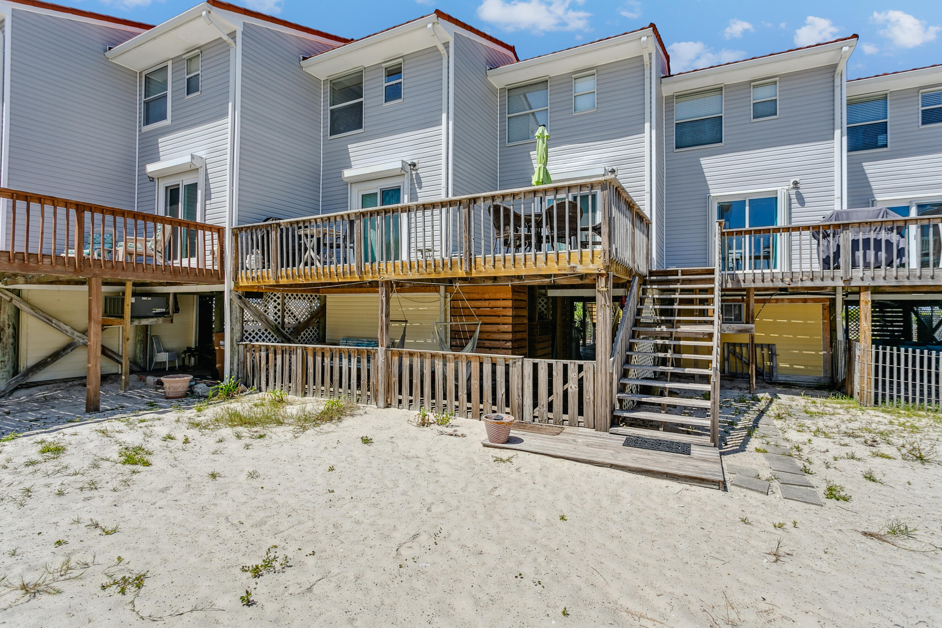 7905 White Sands Boulevard, Unit 2 Navarre, FL 32566 - Photo 32 of 51 a view of a house with a balcony