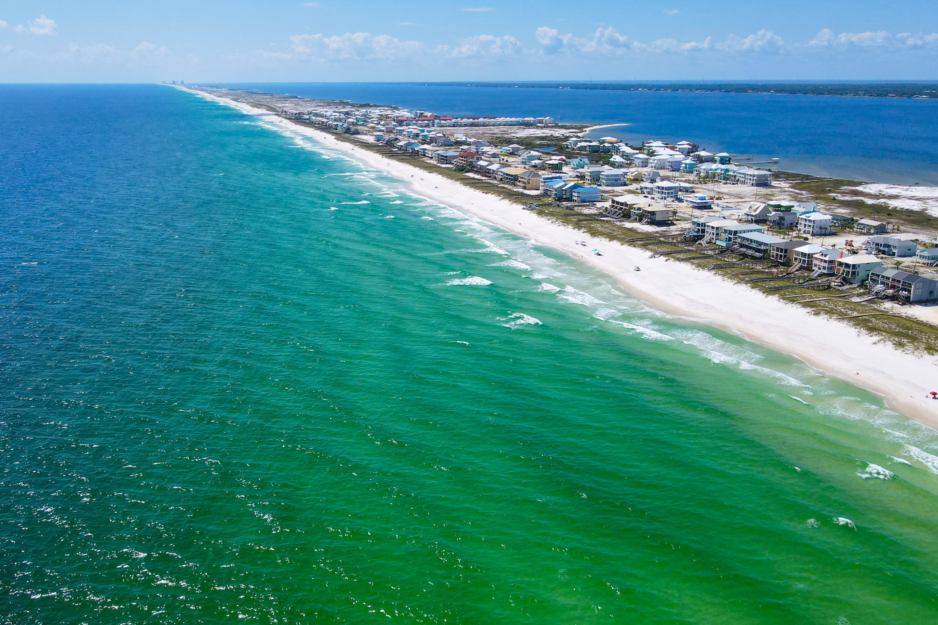 7905 White Sands Boulevard, Unit 2 Navarre, FL 32566 - Photo 47 of 51 an aerial view of residential houses with outdoor space