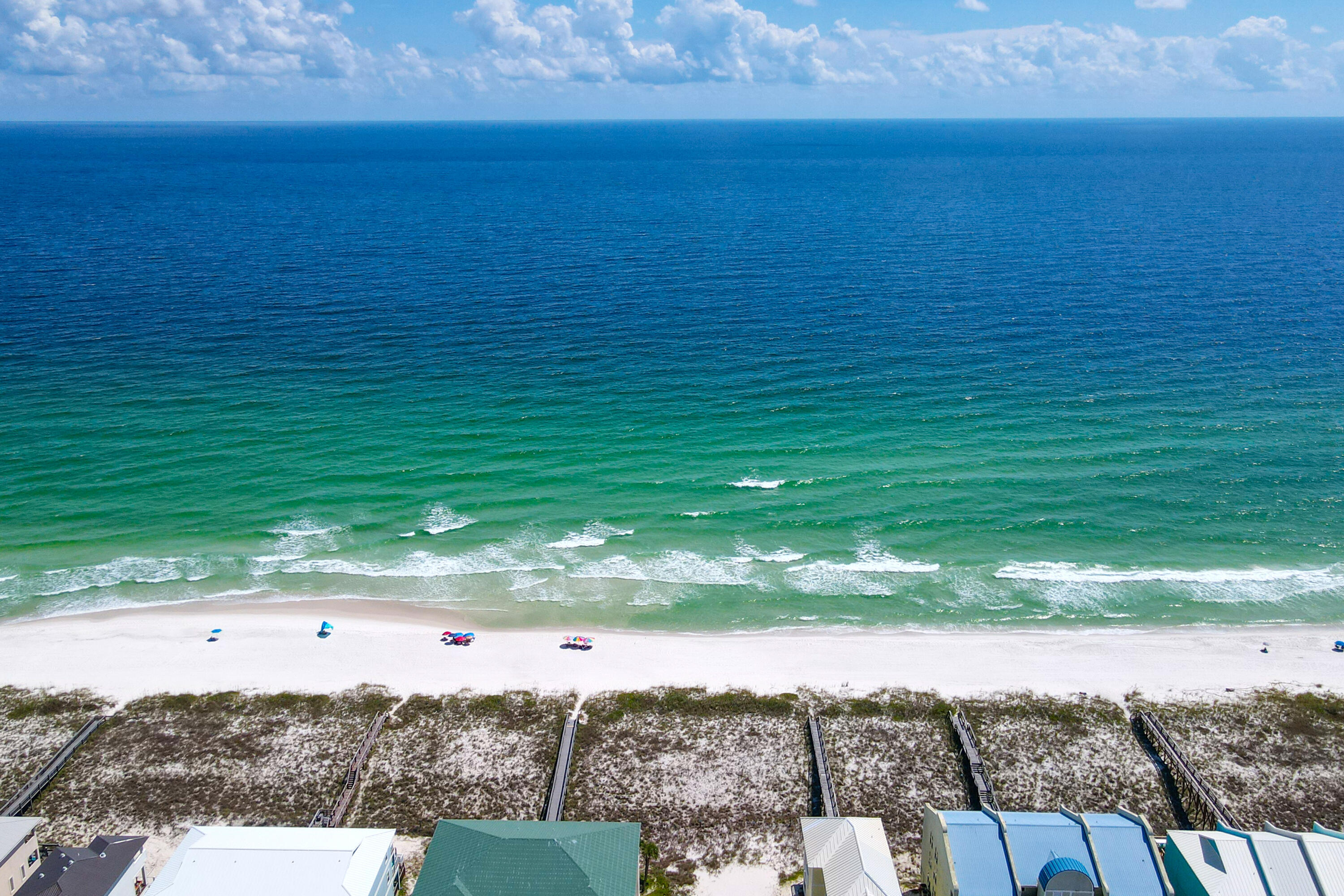 7905 White Sands Boulevard, Unit 2 Navarre, FL 32566 - Photo 49 of 51 a view of a lake from a yard