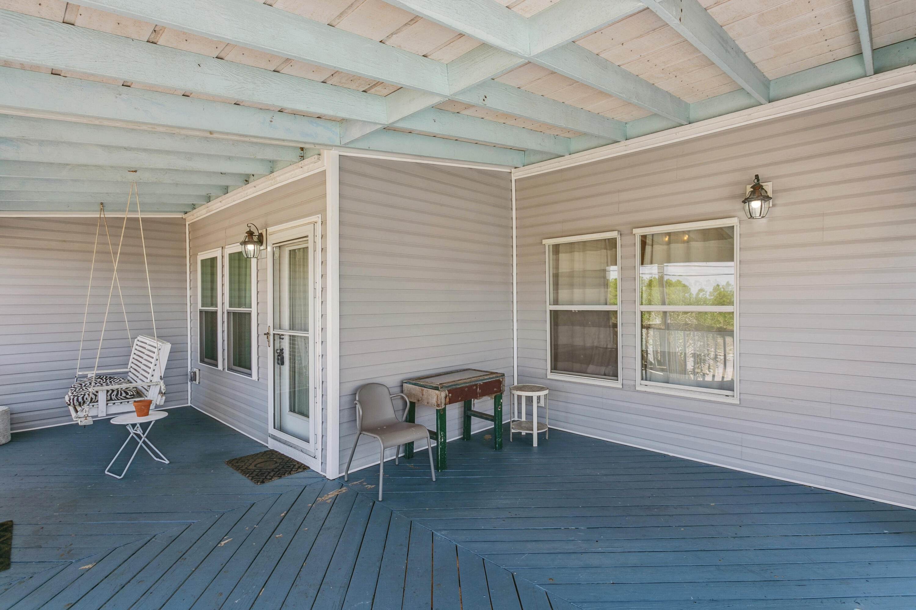 7905 White Sands Boulevard, Unit 2 Navarre, FL 32566 - Photo 10 of 51 a view of a livingroom with furniture and hardwood floor