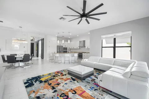 a living room with furniture and a rug