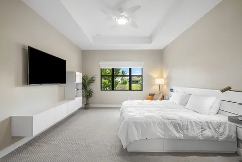 a large white bed in a white room