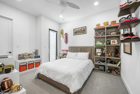 a bedroom with a bed furniture and a window