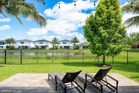 a view of a table and chairs in the park