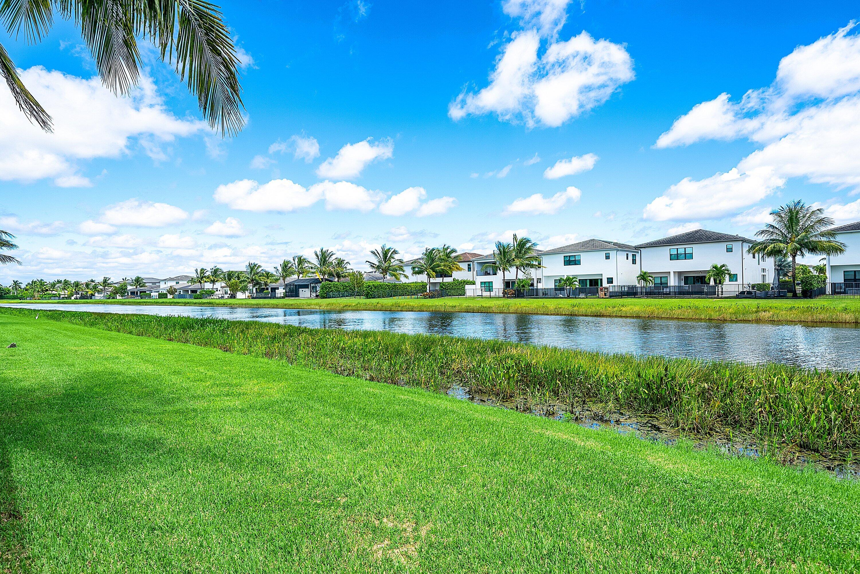 17390 Pagoda Palms Drive Boca Raton, FL 33496 - Photo 28 of 53 a view of a city with a lake in the background