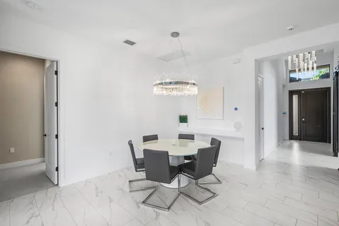 a view of a dining room with furniture