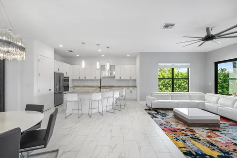 a living room with furniture and a rug