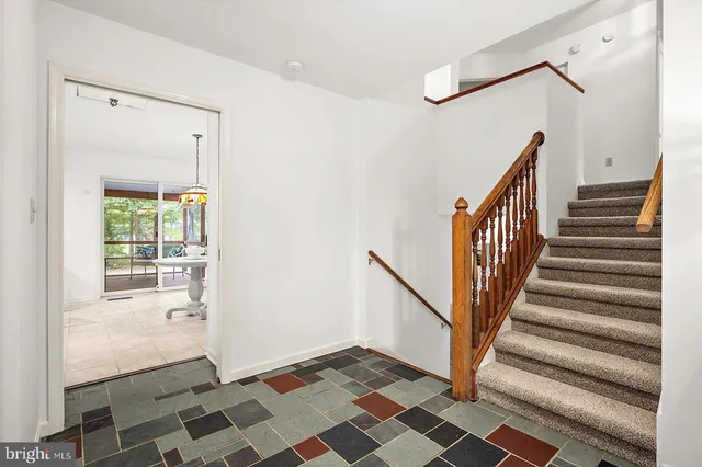 a kitchen with stainless steel appliances granite countertop a stove refrigerator and cabinets