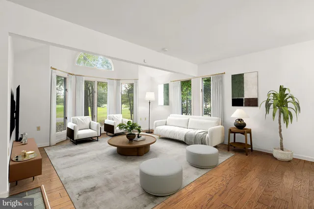 a dining room with a wooden table and chairs