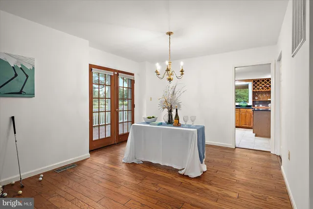 a spacious bathroom with a double vanity sink toilet mirror and shower