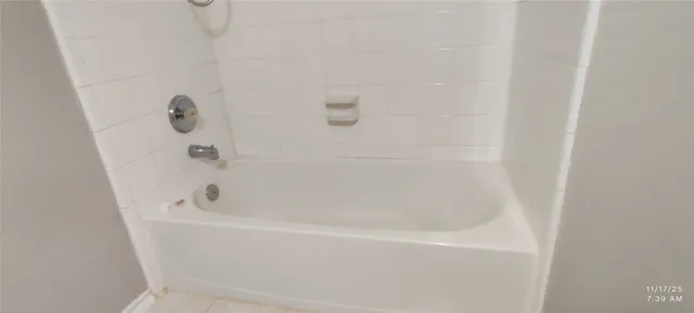 a close up of a bathtub curtain