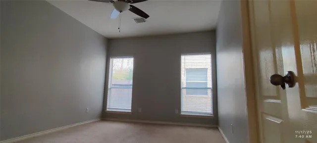 a view of empty room with windows