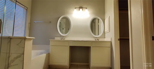 a bathroom with a mirror and a sink