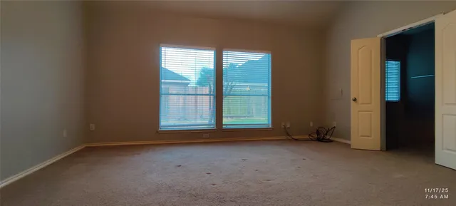 an empty room with windows