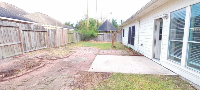 a view of a backyard of the house